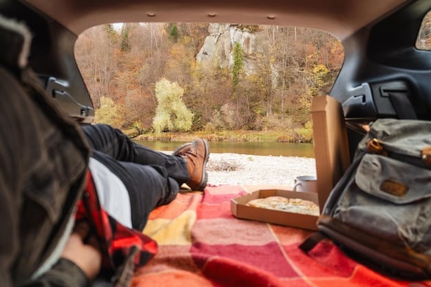 The bed of the 2025 Jeep Gladiator, showing its cargo capacity and tie-down points, with camping gear neatly organized inside.
