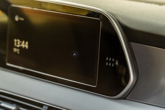 A close-up of the Rivian R1T's dashboard, highlighting its large touchscreen display and minimalist design. The screen shows the navigation system, and the focus is on the clarity and responsiveness of the interface. The image also includes details of the premium materials used in the interior, such as wood trim and leather accents.