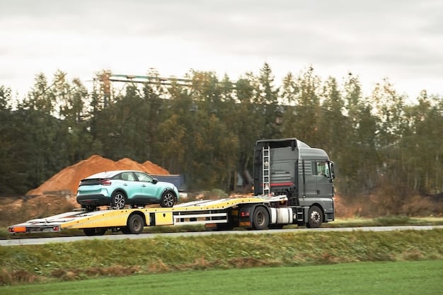 A dynamic shot of the Cybertruck towing a large trailer uphill, showcasing its impressive towing capacity and stability.