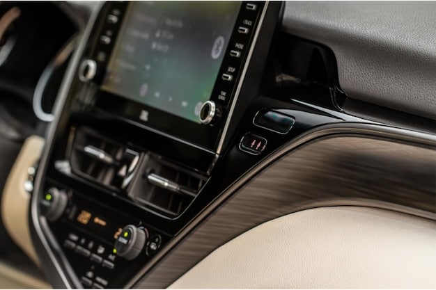 The interior of the 2025 Hyundai Sonata Hybrid, focusing on the infotainment screen displaying navigation, Apple CarPlay, and the car's climate control settings.