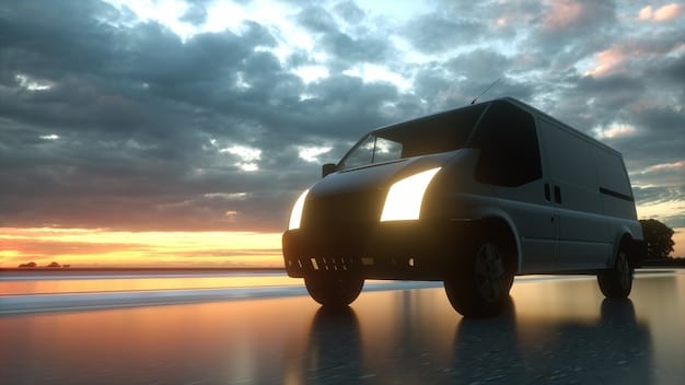 A 2025 Ford Transit driving on a highway. The image highlights the van's aerodynamic design, its wheels and the road in good weather conditons.