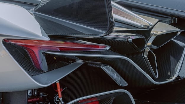A close-up shot of the McLaren 720S's rear wing in action, showing its adaptive aerodynamic properties. The image highlights the carbon fiber construction and intricate design of the wing.
