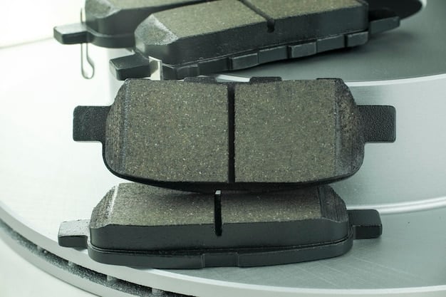 A set of different types of brake pads (organic, ceramic, metallic) laid out on a workbench, with labels indicating their material composition.