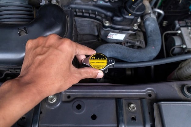 A mechanic's hand holding a dipstick with transmission fluid on it, with a focus on the color and level of the fluid. The background shows the engine compartment.