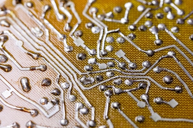 A close-up of an automotive electronic board (ECU) with numerous microchips and semiconductors intricately soldered on. The components are small and densely packed, showcasing the complexity involved in modern vehicle electronics.