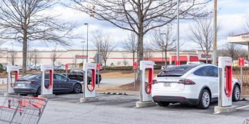 Electric Vehicle Sales Surge: Impact on US Auto Dealerships by 2025 - Cover Image