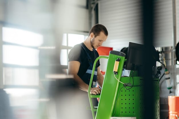 An auto dealership service bay equipped with electric vehicle charging stations, tools, and a technician working on an EV battery pack.