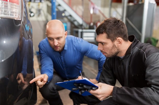 An auto dealership technician undergoing training on electric vehicle battery maintenance, using specialized diagnostic equipment.