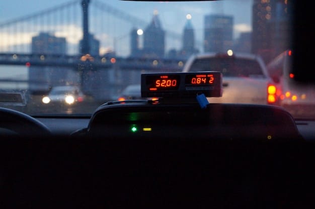A close-up of a car's dashboard displaying an error message indicating a cyber attack. The background shows blurred city lights, emphasizing the real-world impact of cyber threats on vehicles.