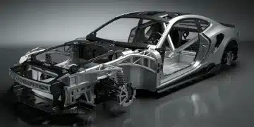 Advanced materials forming a lightweight automotive chassis, illustrating 2026 vehicle weight reduction goals.