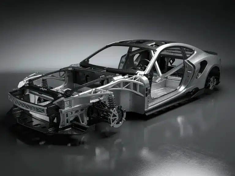 Advanced materials forming a lightweight automotive chassis, illustrating 2026 vehicle weight reduction goals.