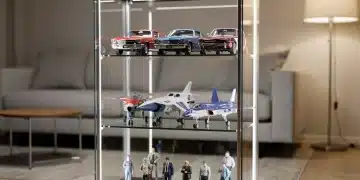 Innovative scale model display in a compact, well-lit cabinet within a modern small living space.