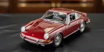 Pristine vintage Ferrari scale model in a display case, symbolizing collectible value.